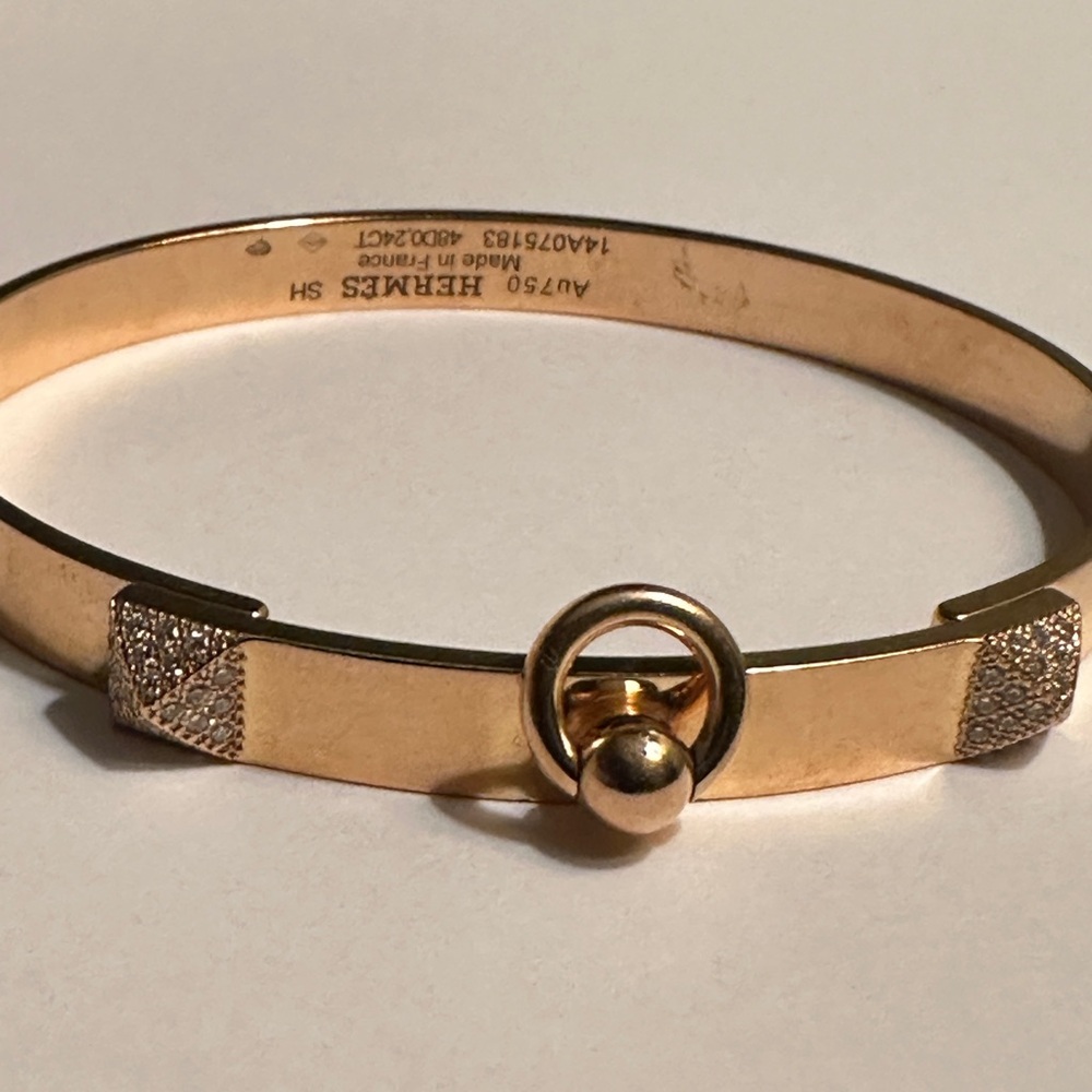 Hermes Gold Tone Bangle Bracelet with Ring Detail